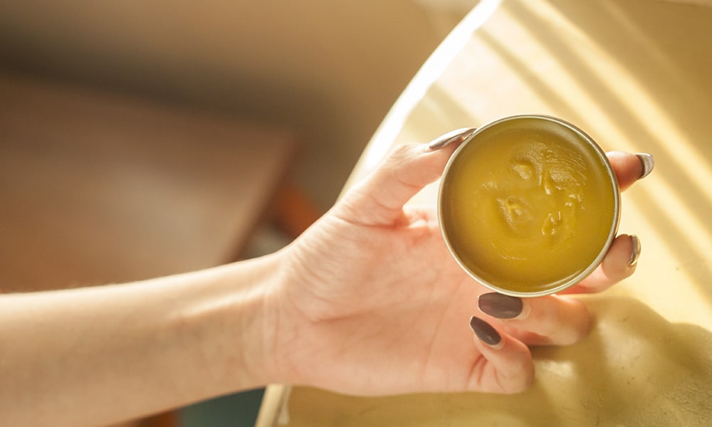 cannabis balm on hand